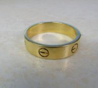 18ct yellow gold gents Cartier screw design ring complete with certificate weight 9.