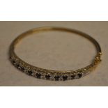 9ct gold sapphire and diamond bangle, set with approx 0.11ct of diamonds, total approx weight 11.