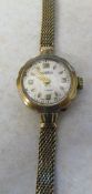 9ct gold Roamer ladies cocktail watch with 9ct gold strap(weight excluding movement 10.