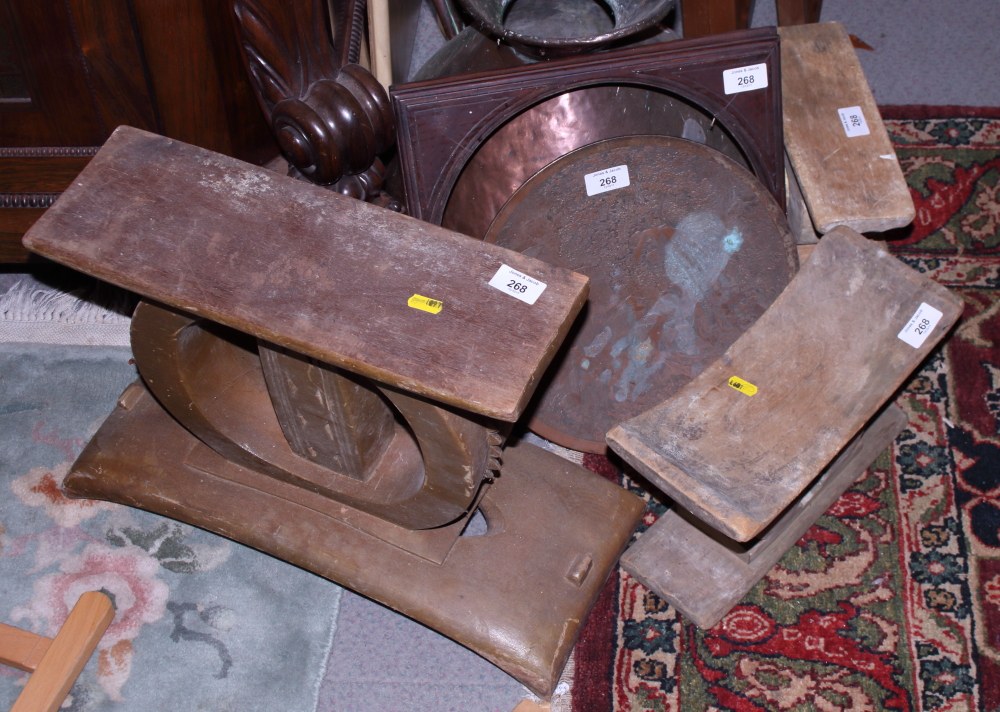 A pair of African early 20th century wooden stools, one larger similar and other items