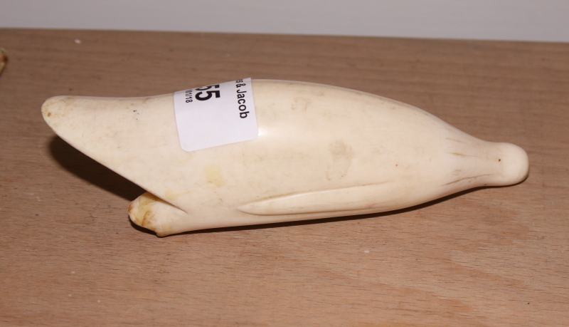 A collection of various sperm whale scrimshaw carvings a carved ivory cane handle with silver collar - Image 5 of 18