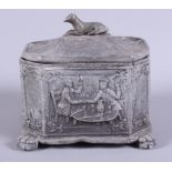 A mid Victorian octagonal lead tobacco jar and cover with greyhound finial, decorated with pub