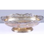 A George V silver basket with pierced rim, on reeded oval foot, Harrison Brothers & Hawson,