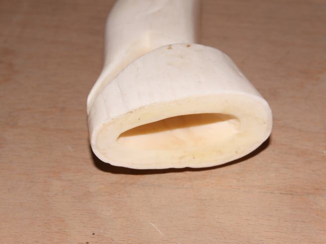 A collection of various sperm whale scrimshaw carvings a carved ivory cane handle with silver collar - Image 16 of 18