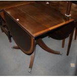 A Georgian design oval mahogany drop-leaf single pedestal dining table