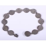 A mid 19th century 'choker' made from 1860s Portuguese 200-reis coins, 12" long
