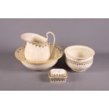 An early 20th century Wedgwood "Strawberry Fruit" toilet set, comprising jug and bowl, soap dish and