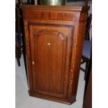 A Georgian oak and mahogany banded corner hanging cupboard enclosed arch panel door, 28" wide