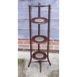 An Edwardian mahogany three-tier cakestand, on splay supports