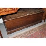 A 19th century oak blanket box, fitted candle drawer, on block base and later castors, 38" wide