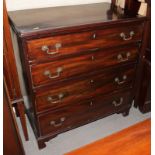 A Georgian mahogany chest of four long graduated drawers with gilt brass handles, on bracket feet,