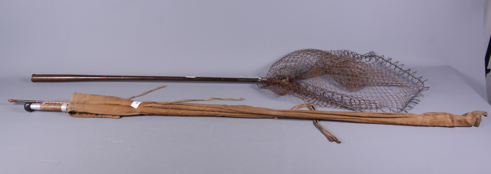 An early 20th century Foster Bros of Ashbourne split cane fishing rod and a landing net, together