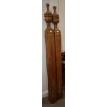 A matched pair of 19th/early 20th century carved golden oak stair posts, 66" high