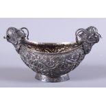 An early 20th century Balinese? silver two-handled lozenge shaped dish, the handles cast in the form