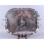 A George V silver two-handled tray with Rococo design wavy rim, Deykin & Harrison, Birmingham