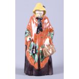 A Gmunder Keramik porcelain figure of an old lady, painted in bright colours, with original label,