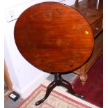 An early 19th century mahogany circular tilt top table with birdcage, on turned column and tripod