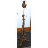 A late 19th century brass and cast iron telescopic brazier lamp, on triform platform base, 71"