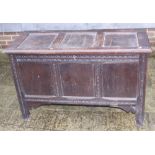 A late 18th century oak three-panel carved blanket chest, on stile supports, 44 1/2" wide