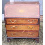 An Edwardian inlaid mahogany fall front bureau, fitted three drawers, on shaped bracket supports,