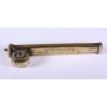 A late 19th century Indian brass pen and ink box, cast with abstract geometric decoration, 8" long