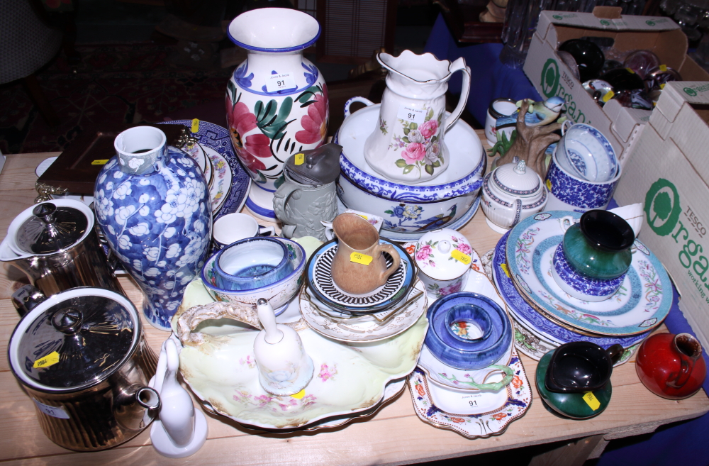 A collection of various decorative ceramics, including plates, vases, bowls, etc