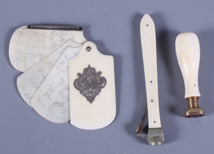 A Victorian ivory aide-memoire with silver inlay, a desk seal with ivory handle and cigar cutter