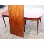 A late 19th century mahogany 'D' end extending dining table with two extra leaves and supports (