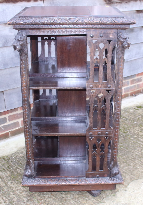 A late Victorian carved pierced oak revolving bookcase with lion mask decoration, 26" square - Image 2 of 3