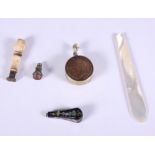 A mid Victorian pique work seal, a turned ivory seal, a mother-of-pearl tourist ware bookmark and
