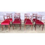 A set of eight early Victorian carved and pierced bar back standard dining chairs with drop-in