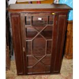 A mahogany side cabinet enclosed lattice glazed door, 29 1/2" wide