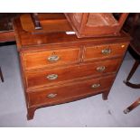 An Edwardian inlaid mahogany chest of two short and two long drawers, on splay bracket supports,