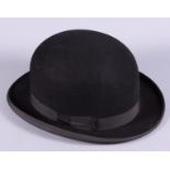 A gentleman's mid 20th century G A Dunn & Co black felt bowler hat with label to the inside