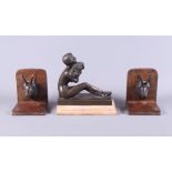 A pair of marble and bronze bookends, in the form of a stag, together with a bronze model of a