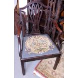 A Georgian mahogany carver chair with needlepoint seat and Gothic pierced splat, on chamfered
