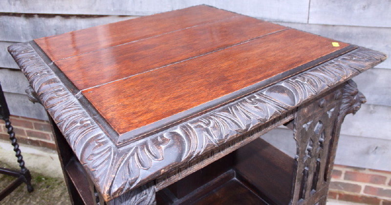 A late Victorian carved pierced oak revolving bookcase with lion mask decoration, 26" square - Image 3 of 3