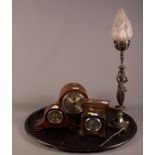 Four early 20th century oak cased drum head and other mantel clocks, a lamp in the form of a