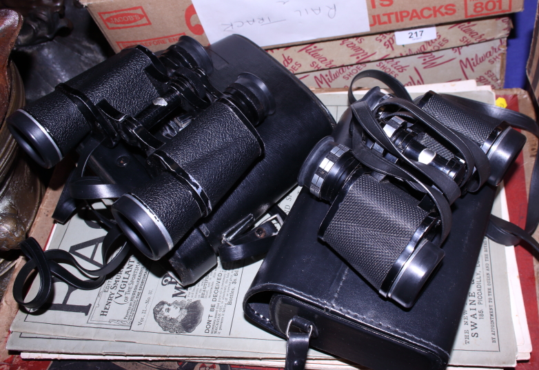 A pair of 7 x 35 binoculars and a pair of 10 x 30 binoculars, in cases