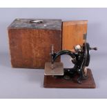 An early 20th century cased Wilcox & Gibbs sewing machine