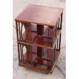 An Edwardian walnut and inlaid table top revolving bookcase, 13" square