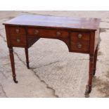 A William IV mahogany and ebony strung side table, fitted two deep and one shallow drawer, on faux