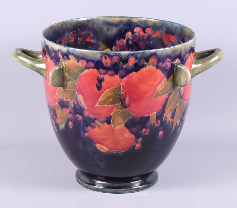 An early 20th century William Moorcroft pottery "Pomegranate" two-handled jardiniere with four