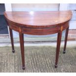 A late Georgian mahogany and inlaid semicircular fold-over top card table, on square taper