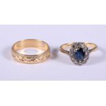 An 18ct gold sapphire and diamond cluster ring, 4.15g gross and a 9ct gold wedding band, 3g