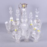 Seven glass decanters, various, a silver plated collared claret jug and a set of five Georgian