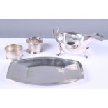 A silver shallow tray, 3.7oz troy approx, a silver sauce boat, 3.4oz troy approx, and two silver