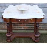 A 19th century mahogany shape front marble top duchess washstand, on plateau base, 48" wide