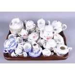 A quantity of miniature and doll's porcelain part tea services, mainly dating from early 20th