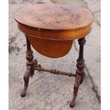 A Victorian burr walnut oval work table with fitted interior and well, on carved splay supports, 28"